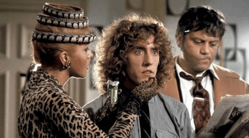 Na imagem, está o personagem Tommy Walker (interpretado por Roger Daltrey, vocalista do The Who), ao centro. À esquerda está Tina Turner, no papel da Acid Queen, e à direita o ator Oliver Reed, como Frank Hobbs