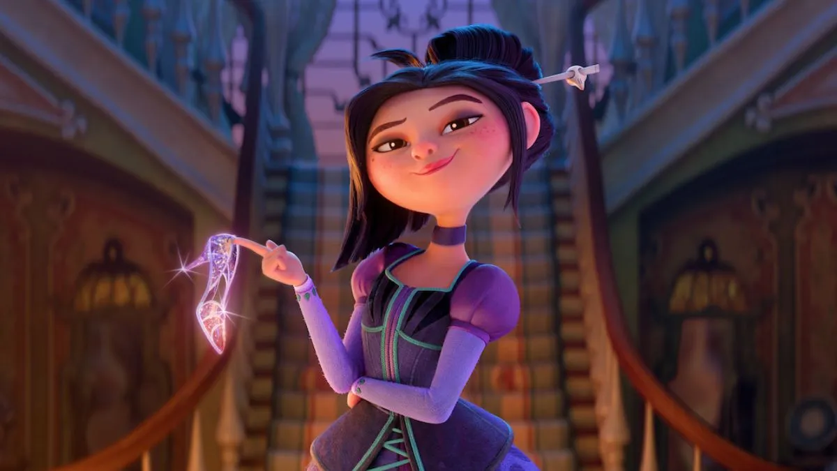 Personagem Lilith do filme 'Tipo Irmãs', segurando um sapatinho de cristal olhando para frente